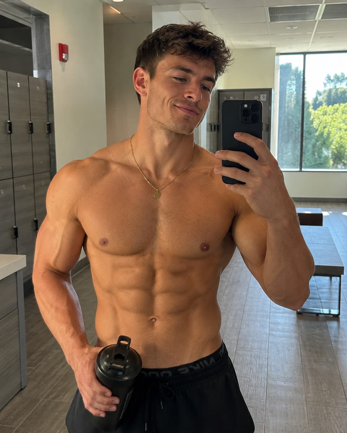 Levi Conely, ranked among the top male fitness OnlyFans creators, taking a locker room selfie.